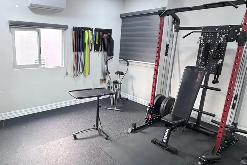 PhysioPro training room: rack, bench and resistance bands.